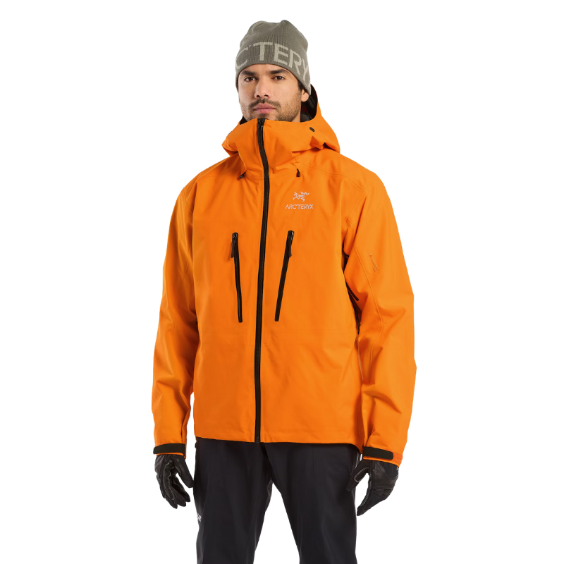 Front product shot of the Arc'teryx Alpine Guide Jacket in Blaze Orange showing the high visibility professional ski guide GORE TEX PRO winter shell available in the Arc'teryx on sale collection.