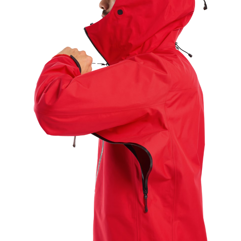 Close view of the Arc'teryx Alpine Guide Jacket in Dynasty II red showing the side vents and zippers designed for pro level ventilation on ski guide missions with GORE TEX PRO protection featured in the Arc'teryx on sale collection.