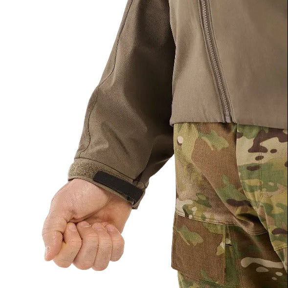 Close up detail of the wrist cuff on the Arc'teryx LEAF Practitioner AR Jacket in Crocodile showing the stretch knit cuff construction, durable Fortius Air 50 fabric, and low bulk insulation designed for secure layering, comfort, and unrestricted movement during tactical operations and outdoor missions.