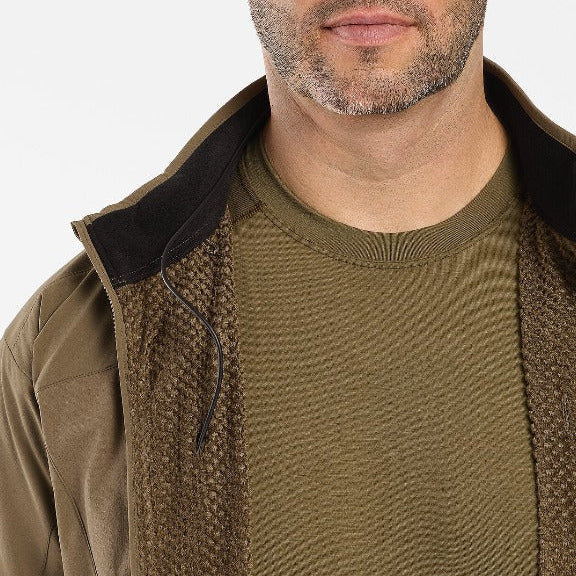 Worn view showing the inside lining and construction of the Arc'teryx LEAF Practitioner AR Jacket in Crocodile, highlighting the Octa Loft breathable insulation, Fortius Air 50 interior structure, and low bulk design engineered for moisture management, thermal efficiency, and high mobility tactical performance.