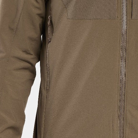 Close up detail of the Arc'teryx LEAF Practitioner AR Jacket in Crocodile showing the No Slip Zip front zipper, TPU zipper pulls, and breathable side vent construction designed for heat management, mobility, and high performance tactical layering in dynamic conditions.