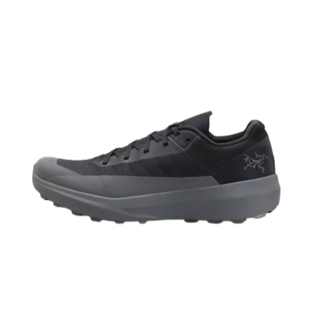 Side view of the Arc'teryx Norvan LD 4 trail running shoe in Black/Graphite featuring a lightweight breathable upper and Vibram Megagrip outsole.