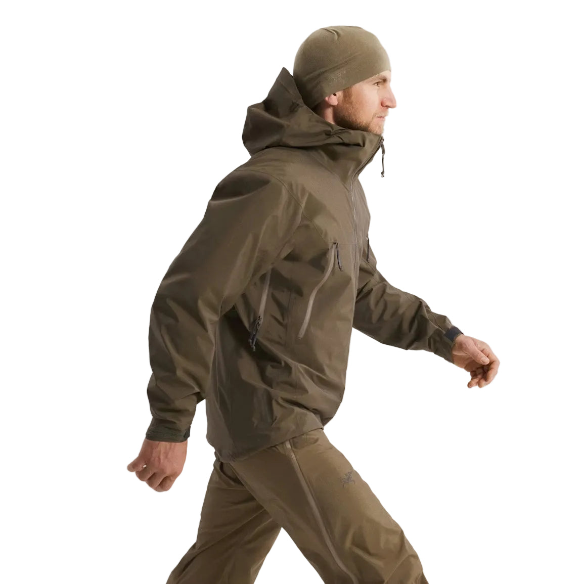Full body side view of the Arc'teryx PRO Alpha LT Jacket Gen 2.2 in Ranger Green, highlighting the jacket length, streamlined military fit, and lightweight GORE TEX 3 layer construction. This PRO-series shell, evolved from the Arc'teryx LEAF program, is designed for mobility, coverage, and wet weather protection in tactical field environments.