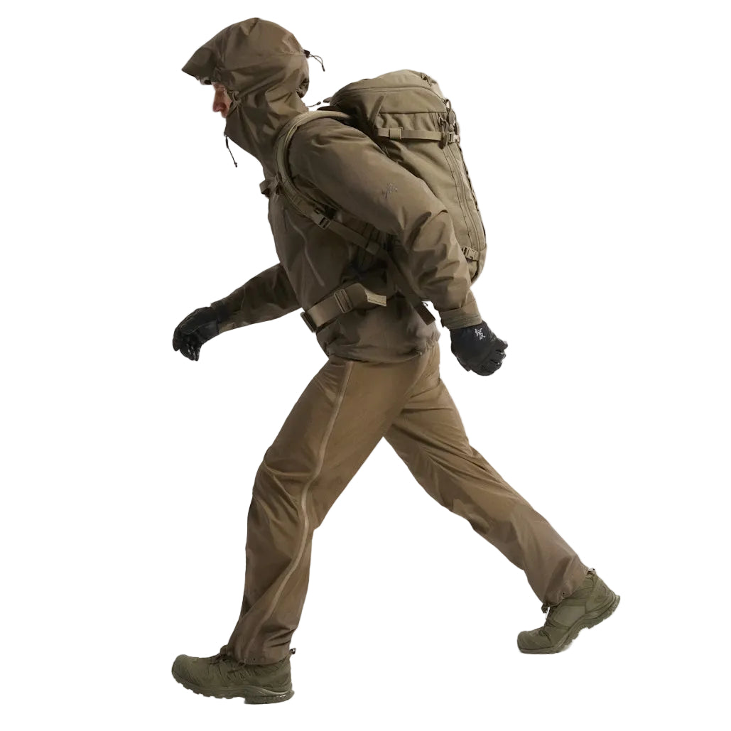 Full body side view of the Arc'teryx PRO Alpha LT Jacket Gen 2.2 in Ranger Green showing the Arc'teryx arm logo placement, streamlined jacket length, and lightweight GORE TEX 3 layer construction. This PRO-series shell, evolved from the Arc'teryx LEAF line, demonstrates mobility, weather protection, and a low profile fit for tactical field operations.