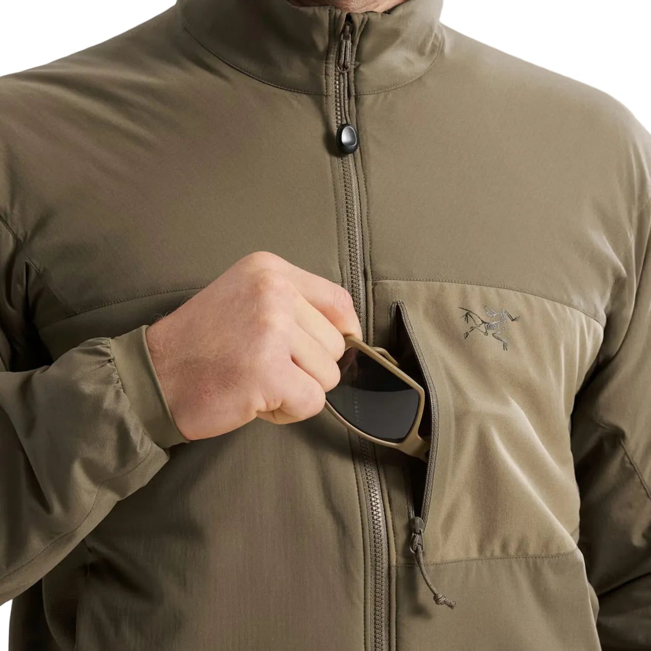 Close up of Crocodile Arc'teryx PRO Atom LT Gen 2.1 zippered chest pocket, tactical insulated outer layer with mission essential storage and durable ripstop construction for operational environments