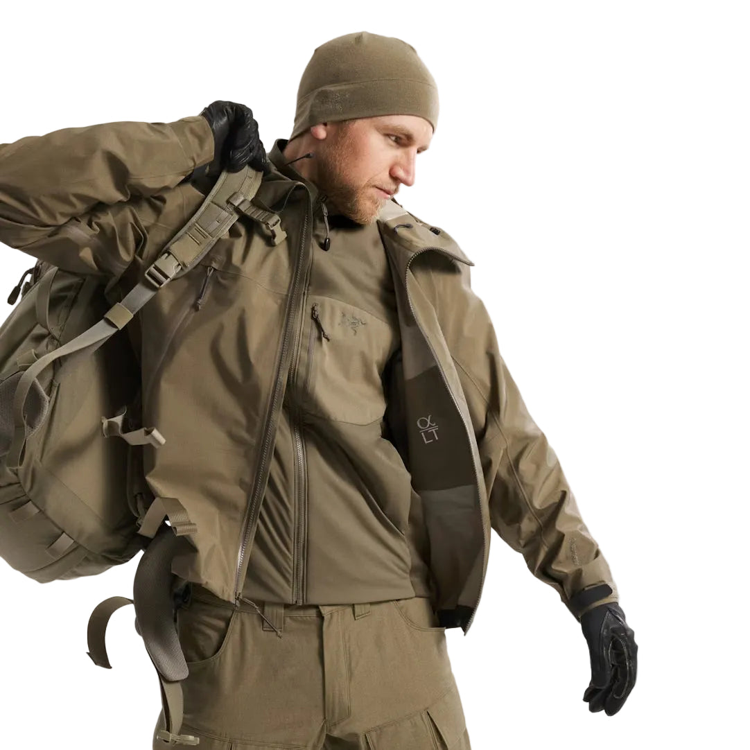 Arc'teryx PRO Atom LT Gen 2.1 Crocodile worn beneath a waterproof hard shell, lightweight breathable insulation jacket built for multi layer cold weather systems and extended field deployment