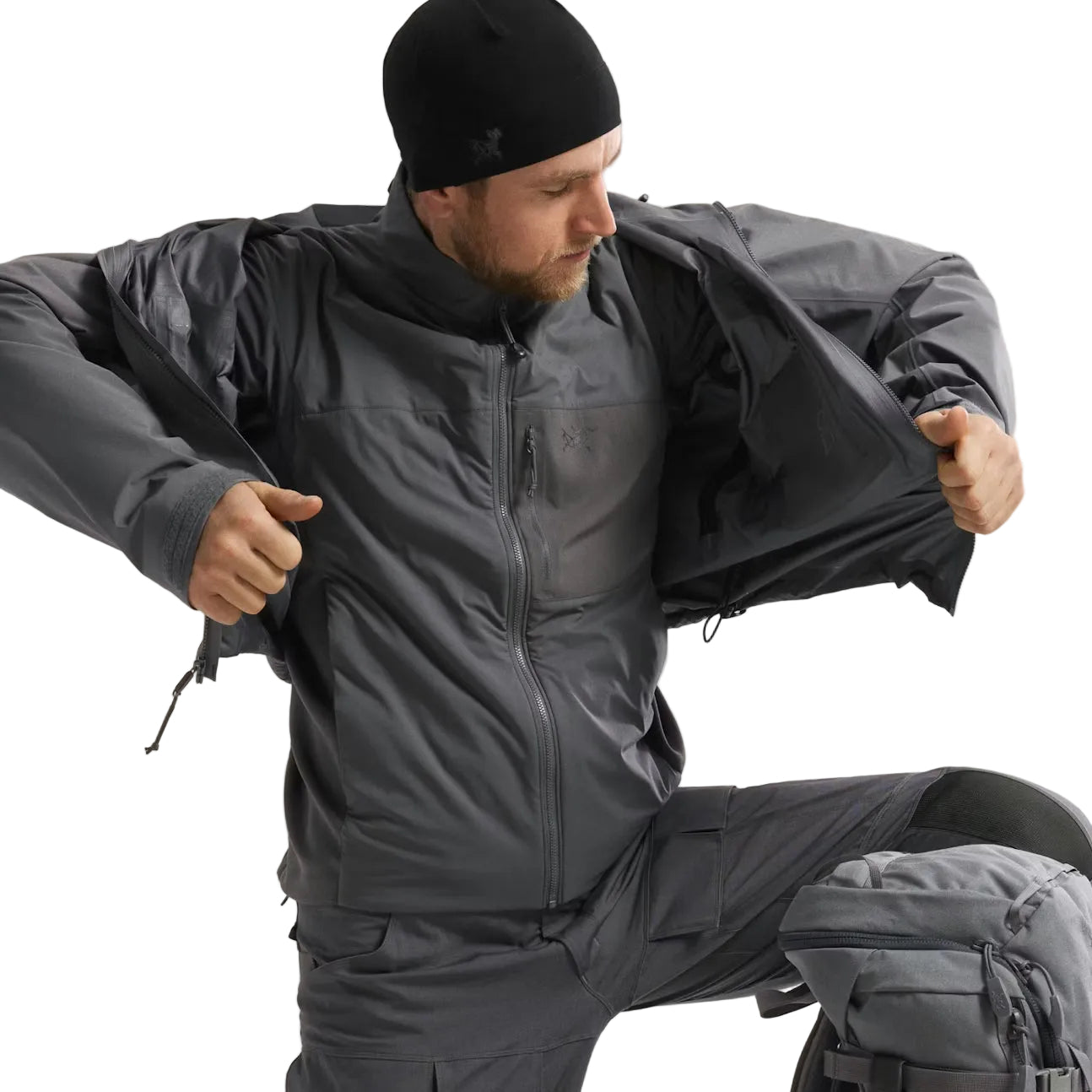 Arc'teryx PRO Atom LT Gen 2.1 Wolf Grey worn under waterproof shell jacket, high performance insulated mid layer designed for multi climate deployment and wet weather tactical operations