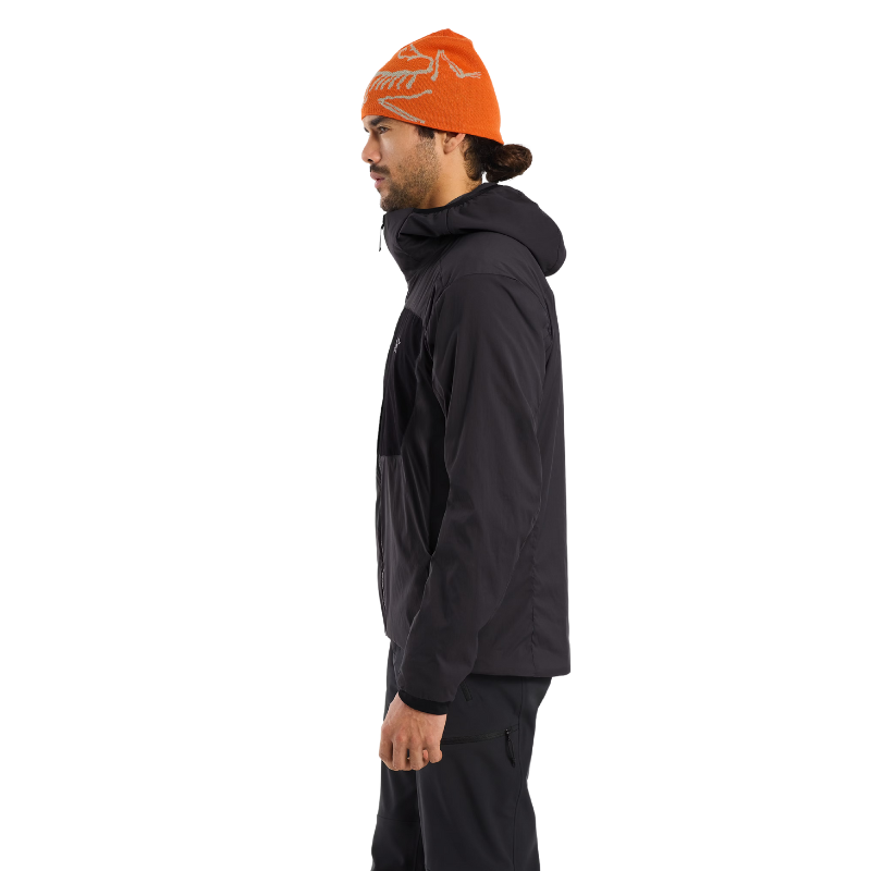 Side view of the Arc'teryx PRO Practitioner AR Hoody in Black showing the articulated fit, gusseted underarms, and streamlined tactical silhouette. Factory spec Arc'teryx LEAF discontinued merchandise marked down for clearance. Lightweight, breathable mid-layer engineered for military, law-enforcement, and high-output missions. Limited quantities, final sale.