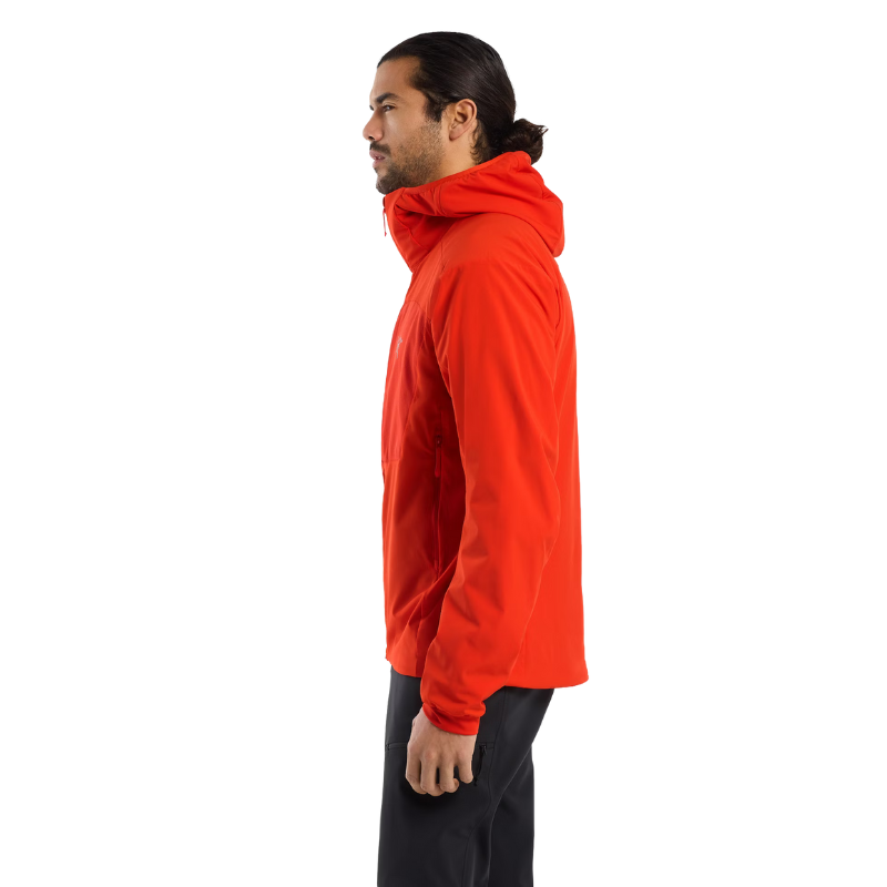 Side profile of Arc'teryx PRO Practitioner AR Hoody in Dynasty Red showing streamlined fit, articulated elbows, and gusseted underarms for mobility. Lightweight Octa® Loft insulated tactical mid layer built for movement and breathability in cold-weather operations.