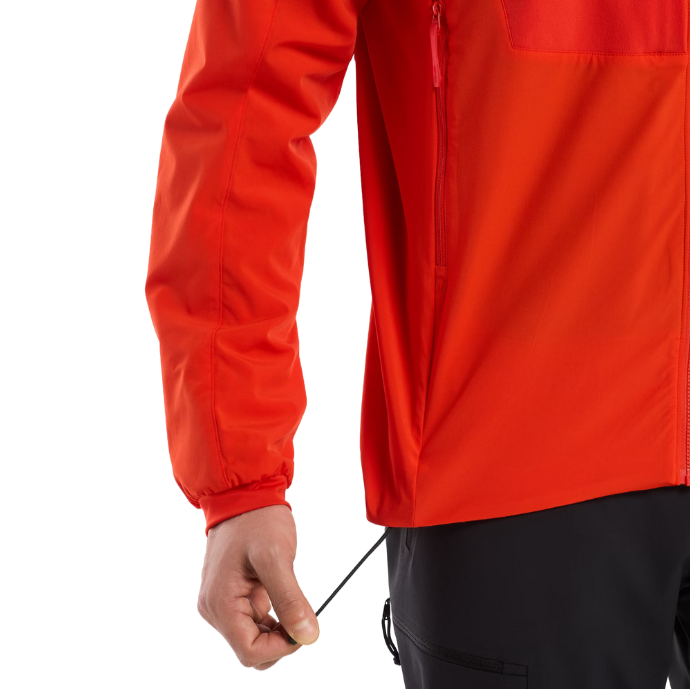 Detail shot of the Arc'teryx PRO Practitioner AR Hoody in Dynasty Red showing the adjustable waist cinch elastic and durable Fortius™ Air 50 fabric. Authentic Arc'teryx LEAF discontinued merchandise on factory spec sale, engineered for tactical and alpine missions with Octa® Loft insulation. Limited stock, final availability.