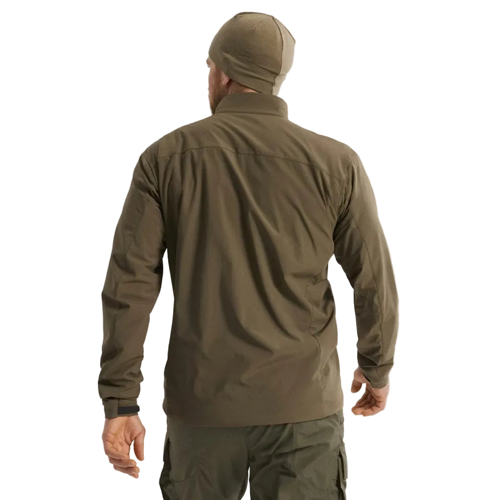 Back view of the Arc'teryx PRO Practitioner AR Jacket in Ranger Green being worn, showing the articulated patterning, drop-back hem, and streamlined Fortius Air 50 shell. Highlights how the PRO-series mid layer maintains mobility, breathability, and low-bulk insulation for users searching for field-ready performance, tactical layering, and real-world movement under gear or armor.