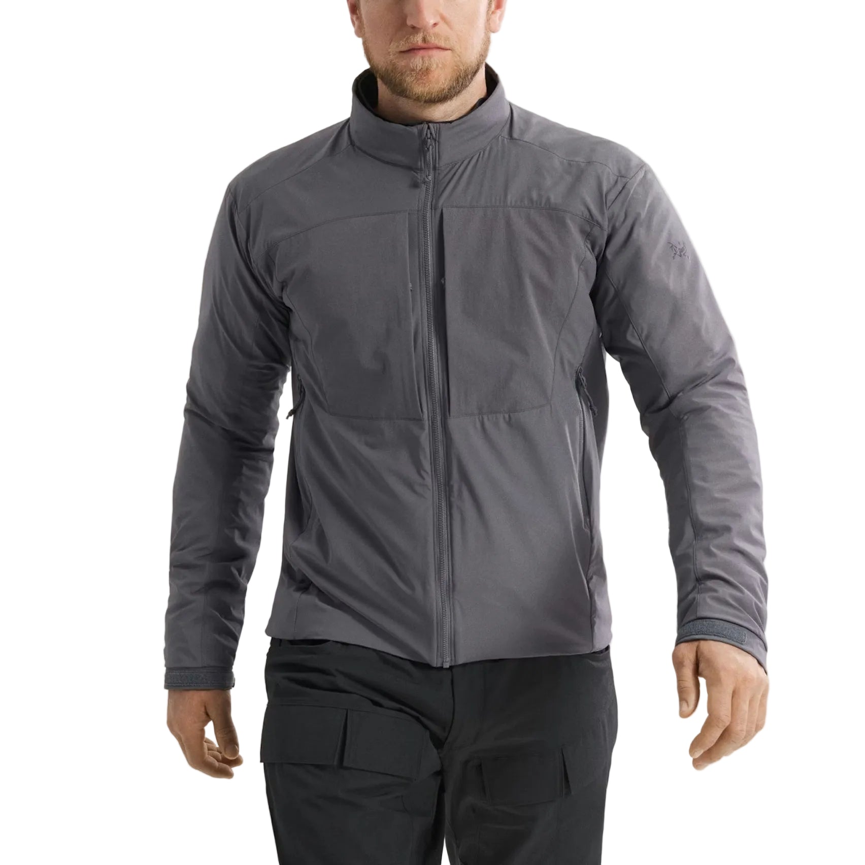 Front view of the Arc'teryx PRO Practitioner AR Jacket in Wolf Grey being worn, showing the streamlined tactical fit, dual chest pockets, and breathable Fortius Air 50 shell. Emphasizes the Octa Loft insulation, temperature-regulating performance, and professional-grade mobility designed for law enforcement, military operations, and technical layering in cold or dynamic environments.