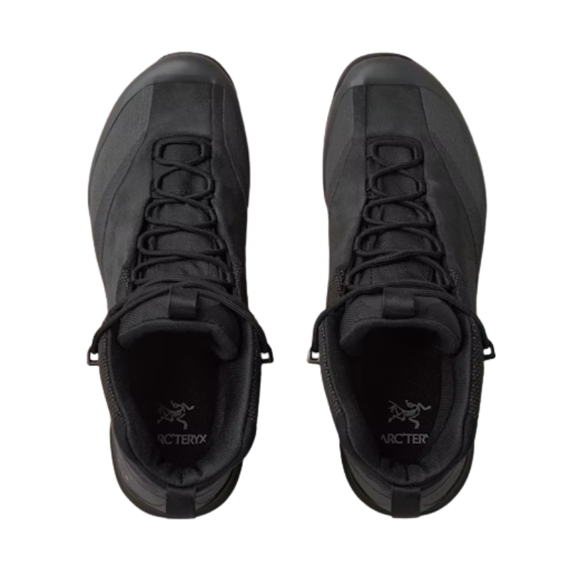 A pair of black Arc'teryx mid-top lace-up shoes shown from a top-down view against a plain white background.