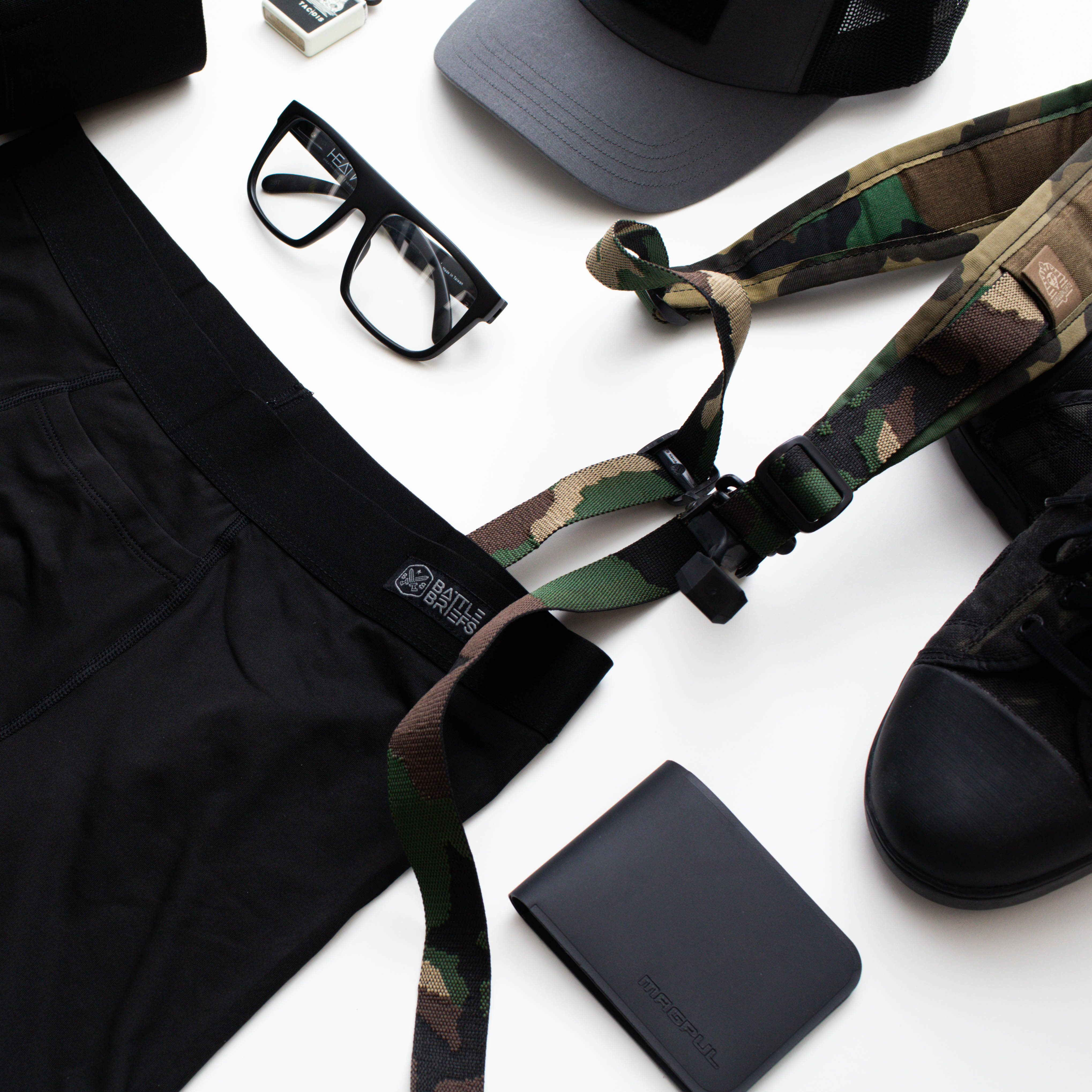 Detail flat lay of Battle Briefs Men’s Athletic Boxer Briefs in Black, showcased as part of your everyday kit. These boxer briefs feature moisture-wicking, quick-drying fabric, anti-microbial technology, and a plush elastic waistband for all-day comfort and support, making them perfect for active wear, gym sessions, and tactical operations.