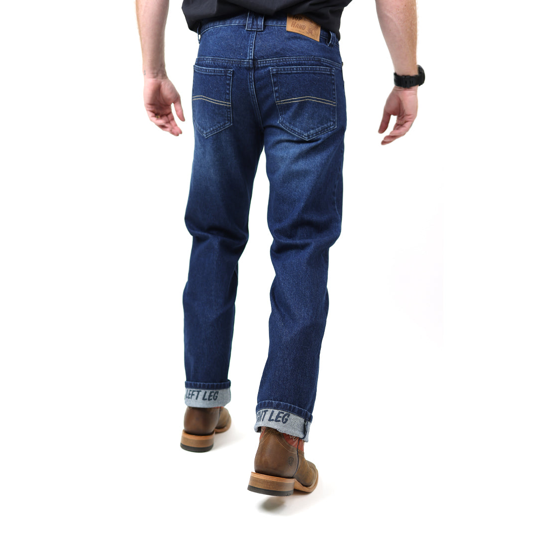 Person wearing blue jeans on a white background