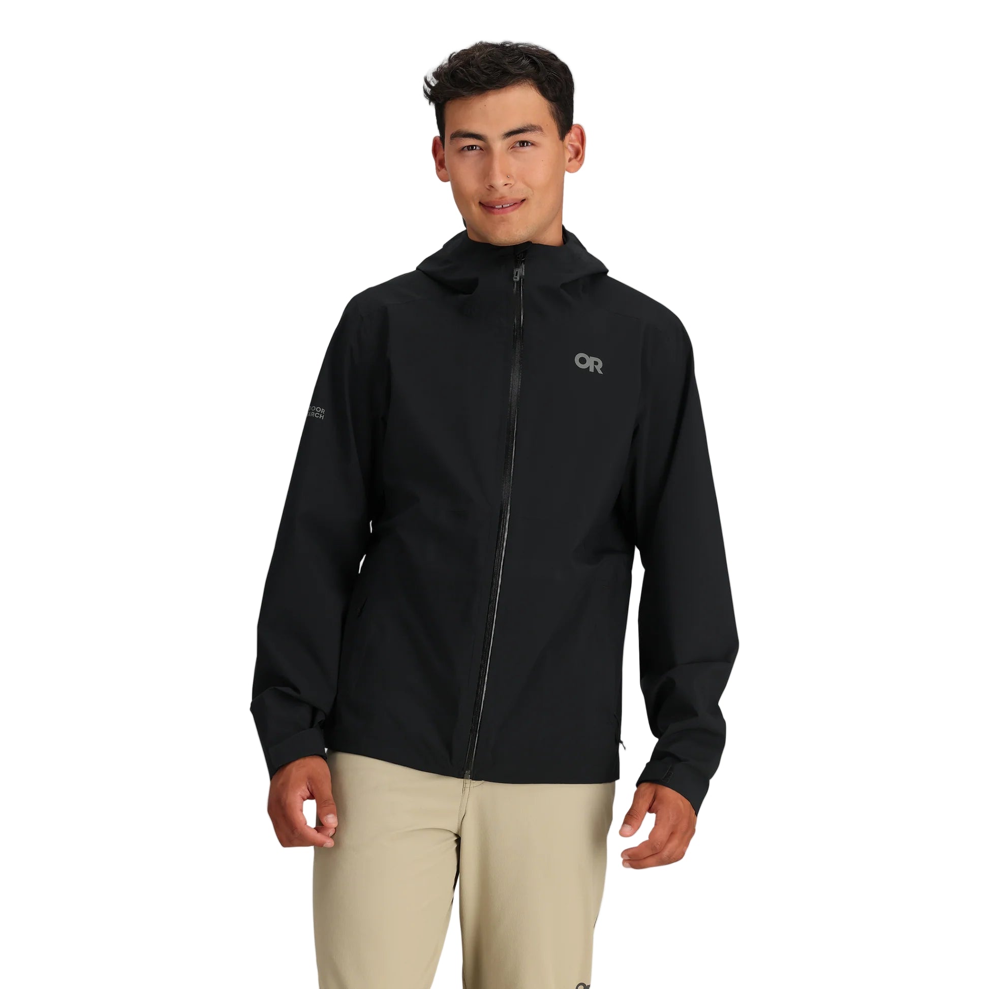 Front view of the black Outdoor Research Stratoburst Stretch Rain Jacket worn by model, showcasing lightweight waterproof tactical rain shell ideal for movement in harsh weather