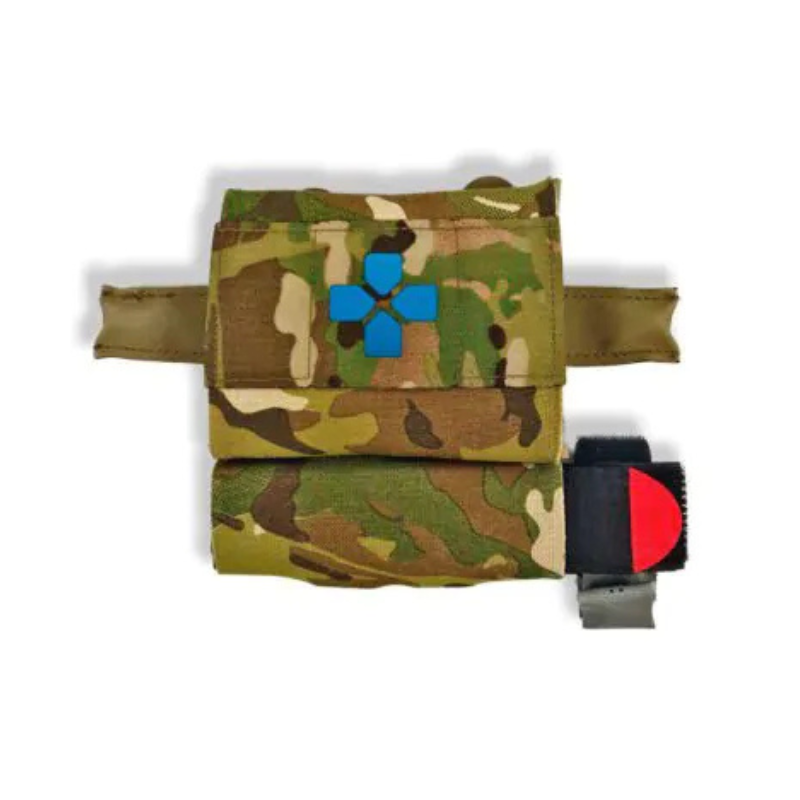 Blue Force Gear The Hammock installed beneath a MOLLE pouch, providing low-profile tourniquet storage without occupying additional mounting space.