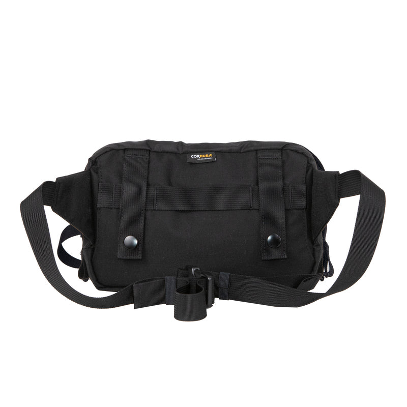 Back view of the Bravo Co Quarter Block 1 in Ripstop/Black, showing MOLLE-compatible rear panel and hideaway strap sleeve. Built with 500D Cordura® nylon for rugged durability, this 2L modular pouch integrates with packs, belts, or chest rigs for EDC and tactical loadouts.