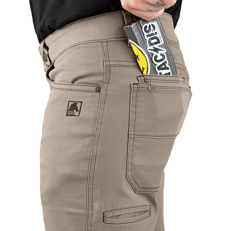 Close-up of Carlos Ray 2.1 TAA Tactical EDC Pants in Flat Dark Earth showing practical use of the side mobile and magazine pocket for secure EDC storage during tactical, range, or everyday activities