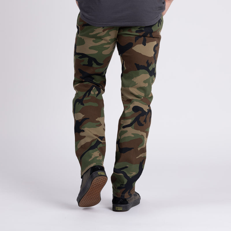Back view of Carlos Ray Chino Tactical EDC Pants in Woodland camo highlighting discreet mag-ready back yoke pockets, double-welted rear pockets, reinforced belt loops, and triple-needle stitching for tactical durability while maintaining a clean low-profile chino style for everyday concealed carry