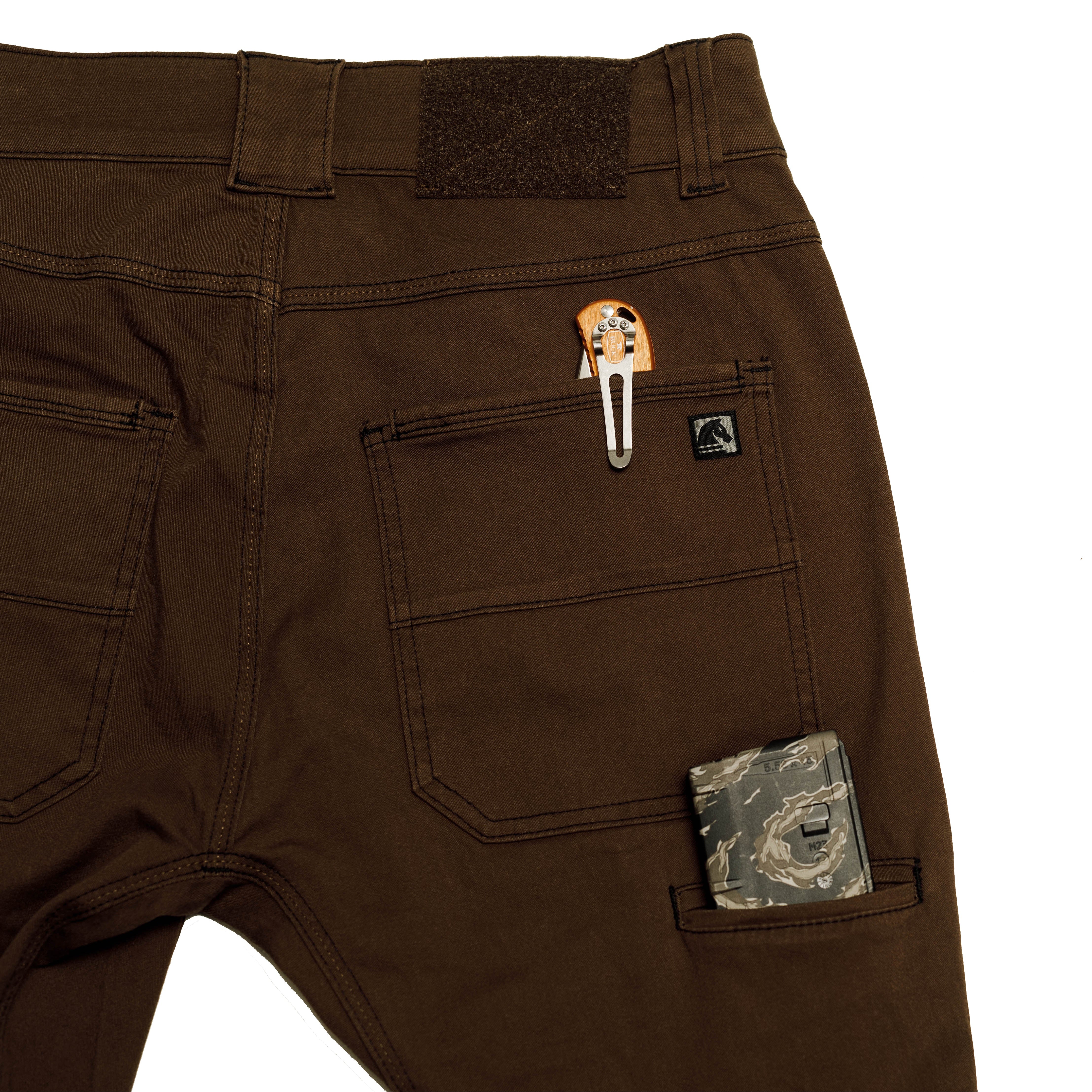 Close-up of the Carlos Ray V3 Tactical Pants back pocket layout, showing the redesigned pocket shape, reinforced openings, and improved everyday carry organization. Highlights durable 4-way stretch twill construction and streamlined functionality built for tactical performance.