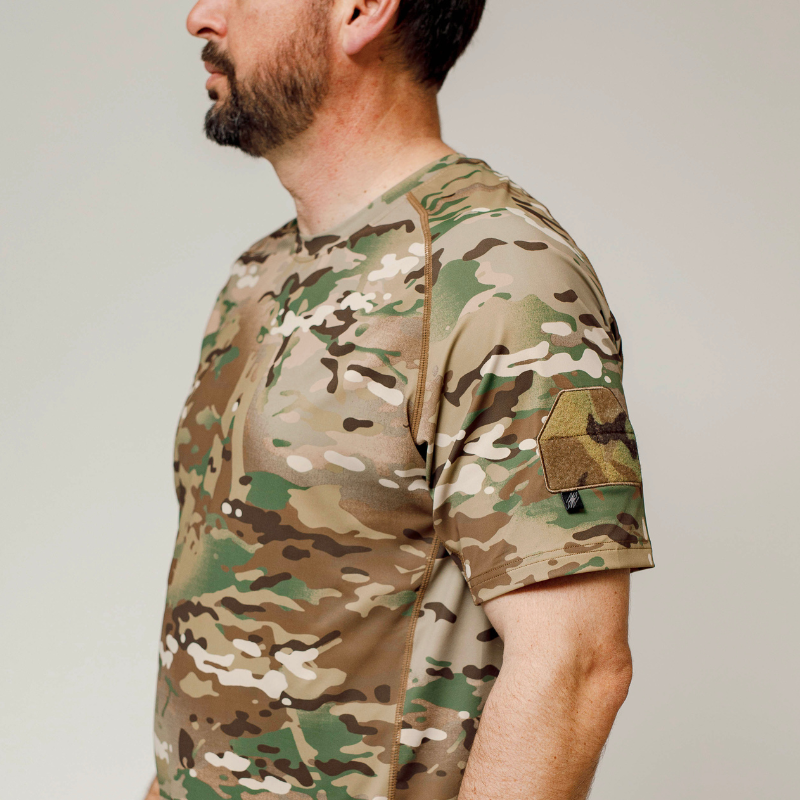 Detailed view of short sleeve MultiCam range shirt showing loop patch panel and durable flatlock stitching for tactical performance and comfort