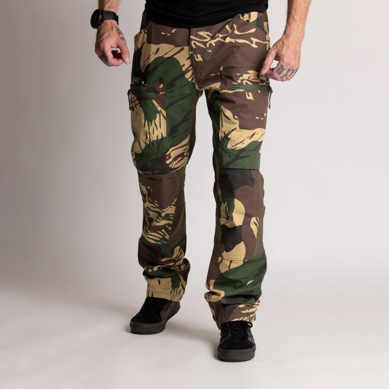 Combat pants with reinforced pocket panels for durability
