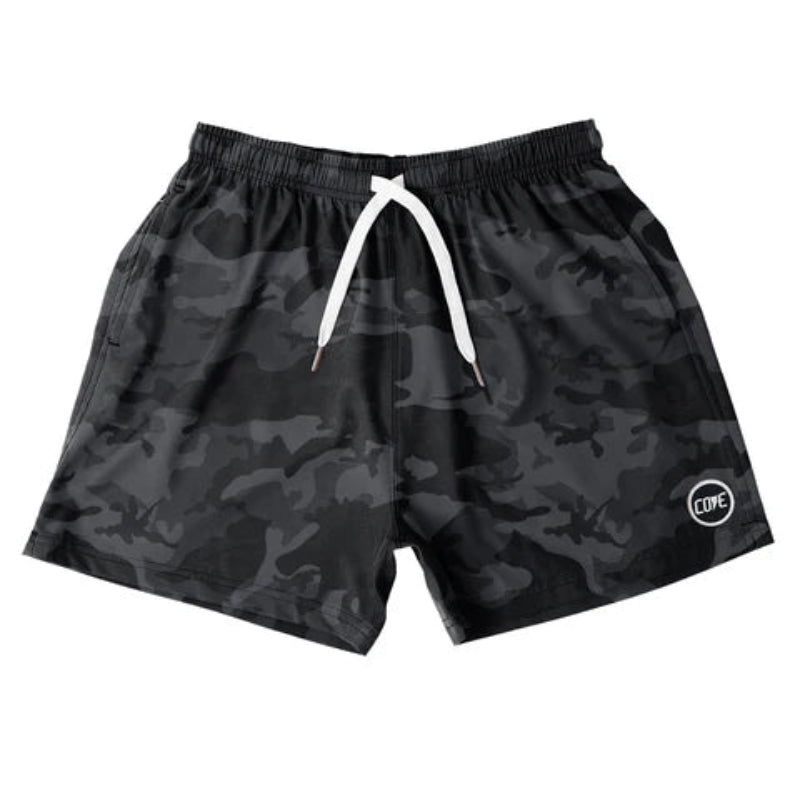 Front view of Cove Black Camo Athletic Shorts made from recycled plastic bottles. These 5" inseam performance shorts feature an elastic waistband with drawstring and zippered side pockets for secure storage. Made from 90% recycled polyester and 10% spandex, they offer comfort and mobility for gym, swim, or lounging.