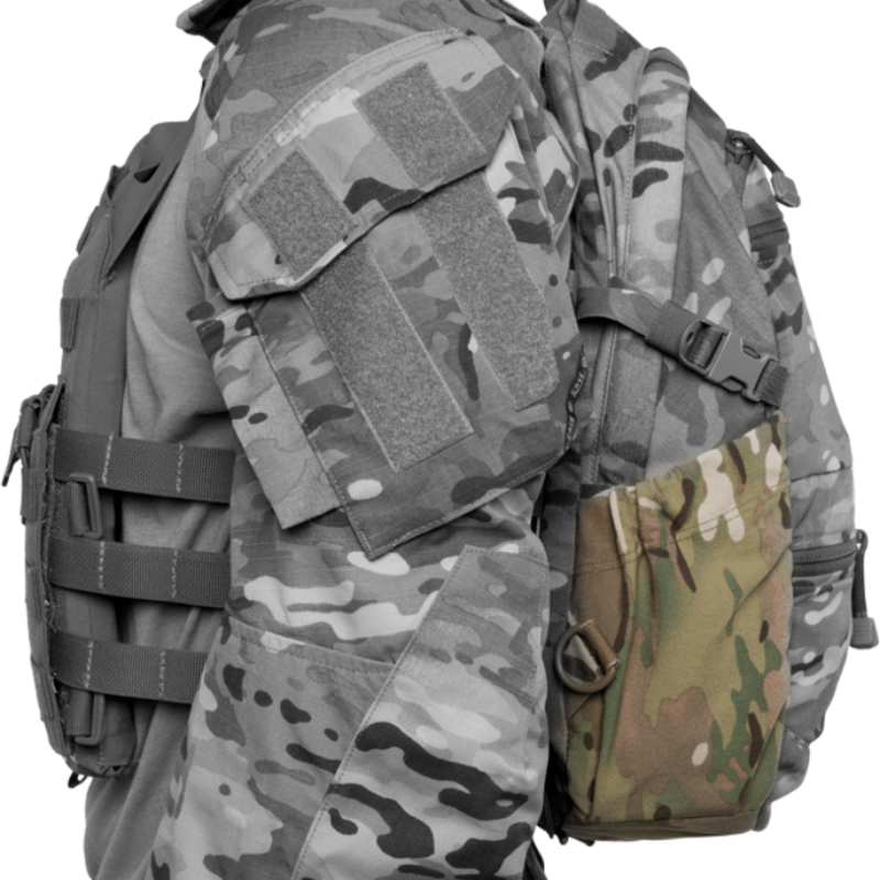 Close up of Crye Precision AVS 1000 Pack external storage pocket showing zipper access and organized layout, modular tactical assault pack compatible with Crye AVS and JPC plate carriers for mission ready gear and hydration carry