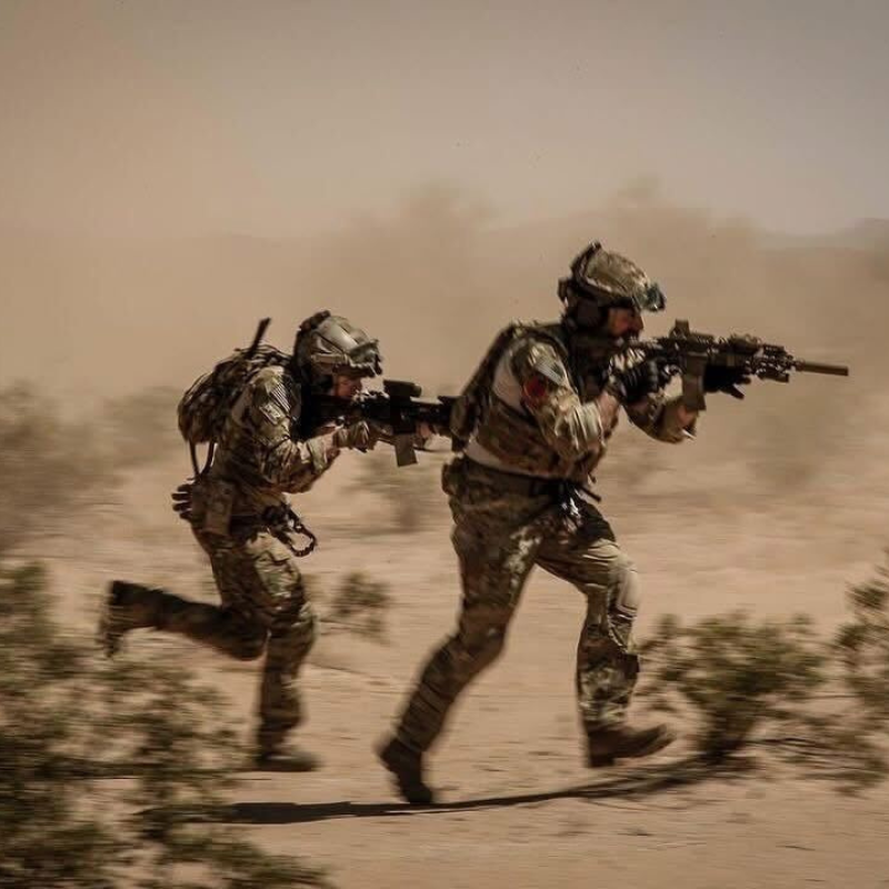 On body action photo of the Crye Precision G3 Combat Pants being worn during combat oriented field operations showing the mobility, durability, and mission driven design in use.