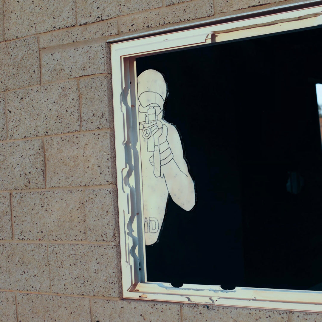 Window with a silhouette target sticking out of the side.