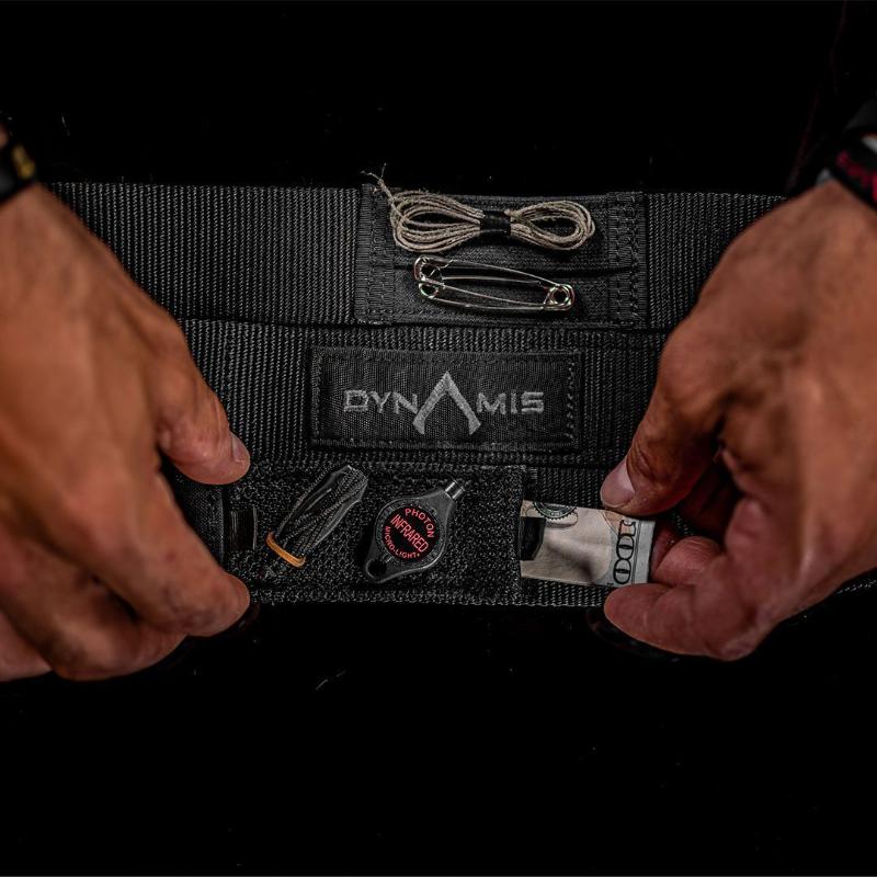 User opening a hidden compartment on the Dynamis Alliance LOPRO Belt to access concealed everyday carry items.