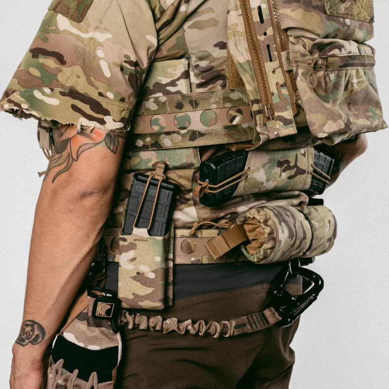 Three quarter rear view of Ferro Concepts Bora Belt in Multicam worn by an operator, showing MOLLE mounted holster and magazine pouches, reinforced tubular webbing spine, and Cobra buckle battle belt integrated into a professional combat and duty gear loadout made in the USA