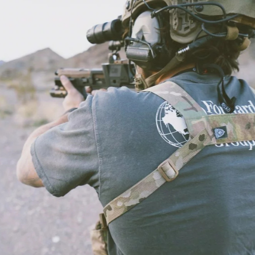 Back view of the Ferro Concepts Chesty Rig Harness Wide in MultiCam worn in the field with full kit. Modular chest rig harness with adjustable H-harness straps and MOLLE webbing, built for military, law enforcement, and range operations.