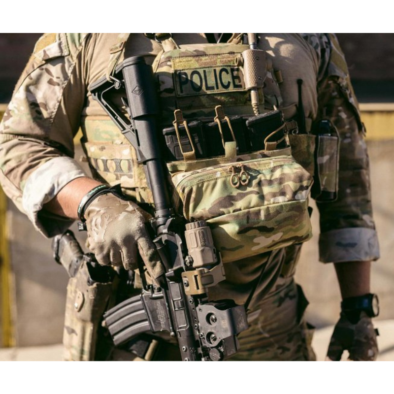Photo showing the Ferro Concepts FCPC V5 Base Plate Carrier actively used in a combat scenario highlighting secure fit, modular MOLLE panels loaded with mission-critical gear, and durable construction that provides protection and mobility. Trusted by operators and tactical professionals for high-threat missions and battlefield conditions.