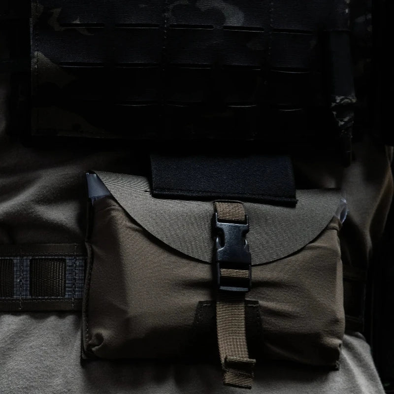 GBRS Group IFAS Individual First Aid System Pouch mounted on military plate carrier and law enforcement duty kit in field environment ready for rapid medical response