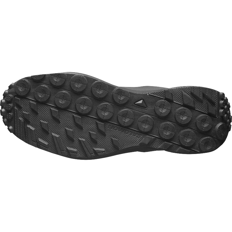 Black shoe sole with tread pattern on a white background