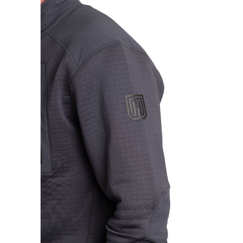 Side view of MTHD Overland Zip-Up Fleece Jacket in Gunmetal Grey highlighting subtle arm branding detail, sleek Polartec Power Air fabric, and athletic cut designed for tactical mid-layer performance and everyday outdoor wear