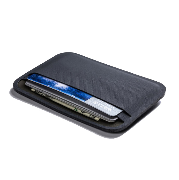 Magpul DAKA Essential Wallet Black loaded with multiple ID cards credit cards and folded bills demonstrating compact EDC capacity
