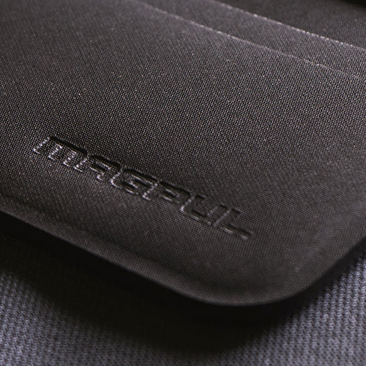 Magpul DAKA Everyday Wallet carried in front pocket showing low profile slim design with clear ID window and minimalist EDC setup