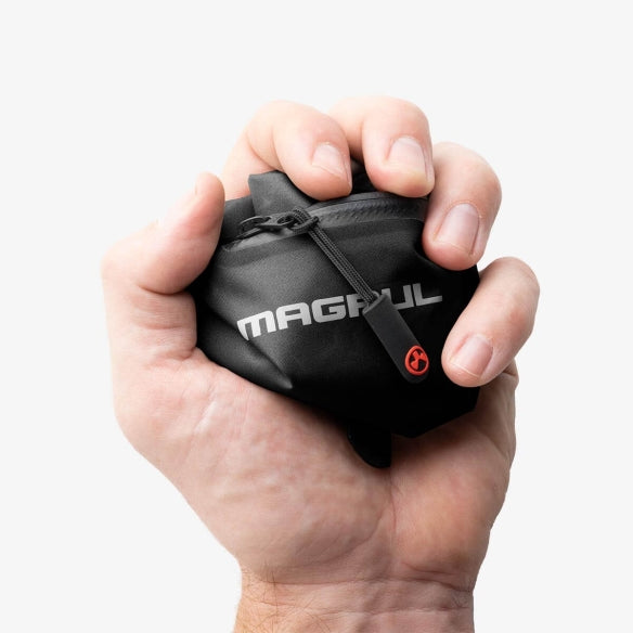 Magpul DAKA Lite Pouch Large Black crunched in hand showing flexible collapsible lightweight nylon construction