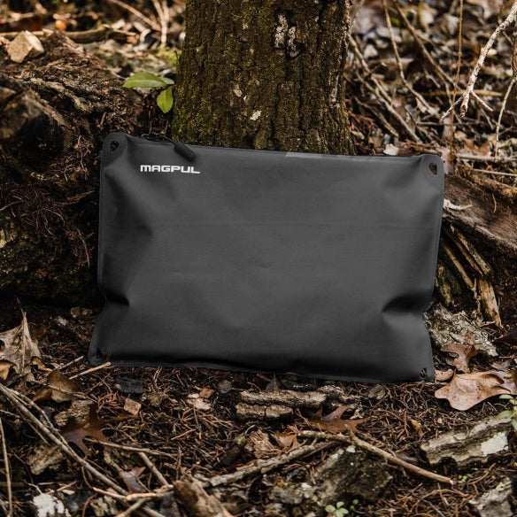 Magpul DAKA Lite Pouch Large Black holding electronics tools and clothing layers demonstrating lightweight packable storage