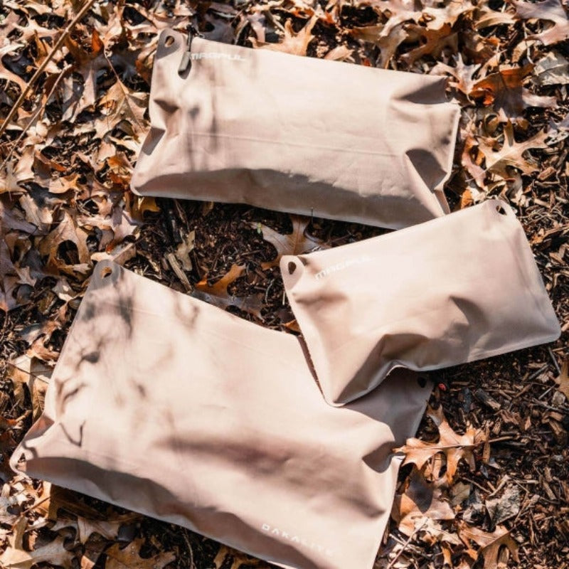 Magpul DAKA Lite Pouch Medium Flat Dark Earth holding emergency gear electronics and tools in lightweight travel setup