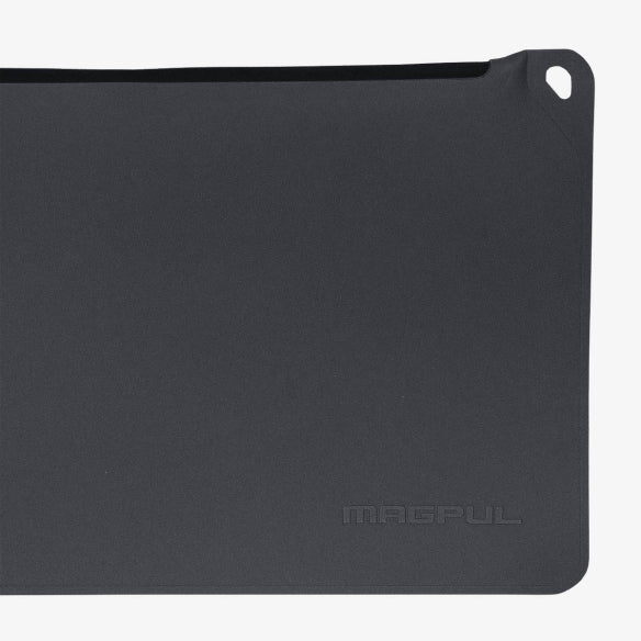 Magpul DAKA Pouch Medium Grey showing reinforced carabiner pass through for attaching to travel bags range kits or marine gear setups