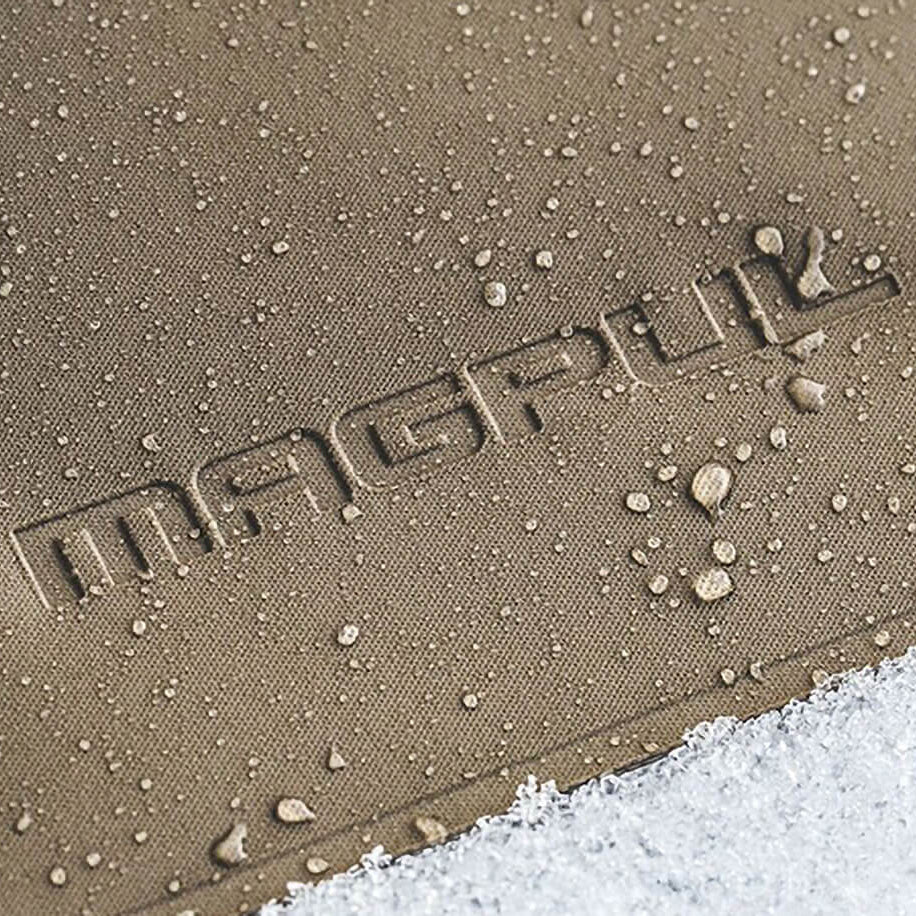 Magpul DAKA Pouch Medium showing gritty anti slip polymer texture with water droplets and snow demonstrating RF welded waterproof construction and all weather gear protection