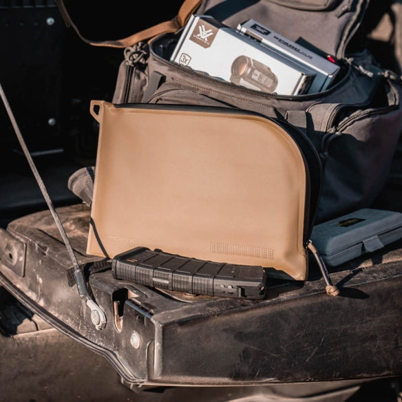 Magpul DAKA Single Pistol Case Flat Dark Earth organized inside range kit with handgun magazines and accessories demonstrating durable soft case transport solution