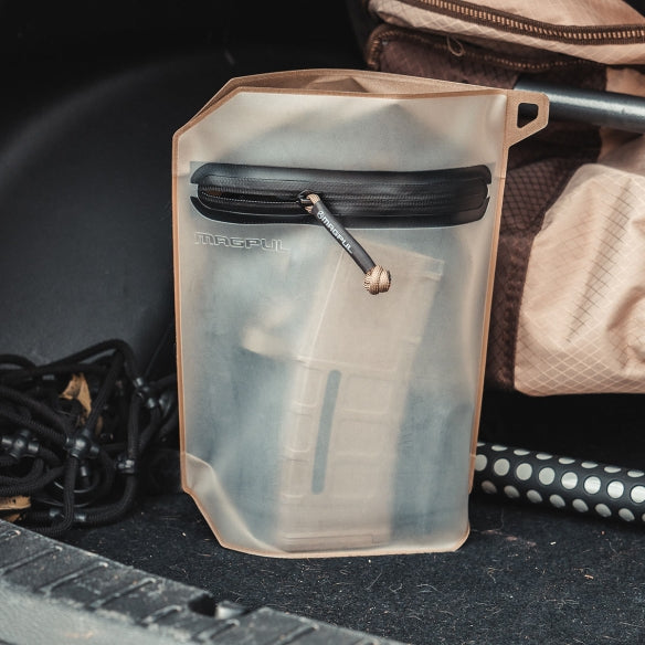 Magpul DAKA Volume Pouch Flat Dark Earth expanded and filled with tools electronics and accessories
