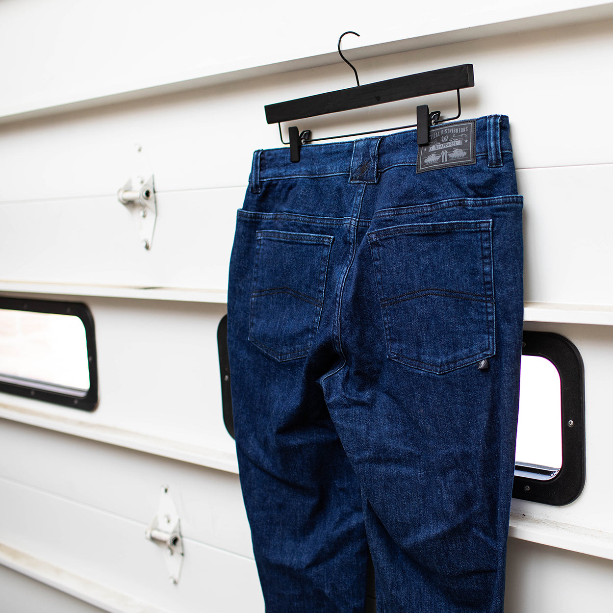 Close up of the TD McQuade Tactical Jeans in the Midnight wash showing the reinforced back pocket stitching, AR mag compatible EDC yoke pocket layout, and durable stretch tactical denim designed for users searching for the best tactical jeans, CCW pants, and everyday carry denim.