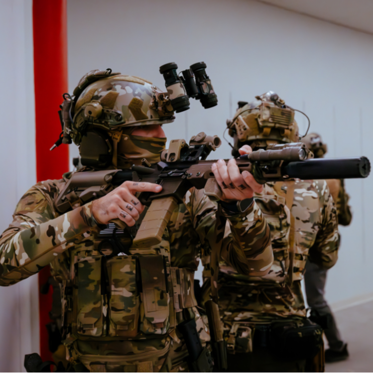 Operator wearing MultiCam Shooter Shirt during live-fire range training, showcasing the tactical performance, stretch, and breathability of the MultiCam range shirt under real-world conditions