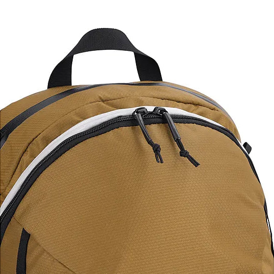 Detail view of the Outdoor Research Adrenaline Day Pack 30L in coyote, showing durable zipper placement on the padded top pocket and main compartments for secure storage during alpine missions and tactical use.